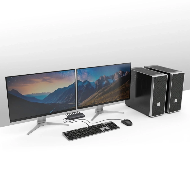 デスクでデュアルモニターと2台のPCを共有するイメージ